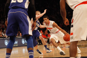 Michael Carter-Williams drives to the hoop in Syracuse's Big East tournament opener against Seton Hall. The point guard tied a tournament record with 14 assists.