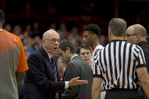 Jim Boeheim speaks with a referee during the second half of Sunday's narrow win. After the game, he voiced his concerns regarding his team's fundamentals.