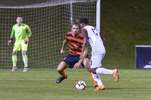 Sondre Norheim defends against the Bonnies. He's added an offensive element to his game this season.