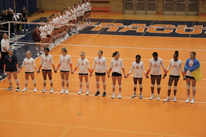 Sporting blue and gold ribbons in their hair and working closely with the Ukrainian club at SU, Syracuse volleyball showed its support for the war-torn country in its ACC home opener.