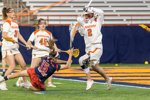 Delaney Sweitzer blocks a shot from Stony Brook's Morgan Mitchell. Despite allowing a first quarter hattrick from Mitchell, Sweitzer ended the contest with eight saves