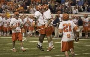 The Syracuse men's lacrosse team celebrates after beating Siena in the opening round of the NCAA tournament Sunday.