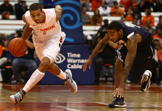 Michael Carter-Williams brings the ball up the court against Pace.