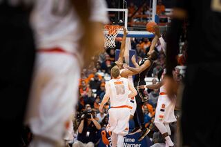 Cooney looks on as a Wake Forest player attacks the rim.