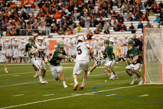 Syracuse senior Nicky Galasso tries to bounce a shot past Siena goalie Tommy Cordts.